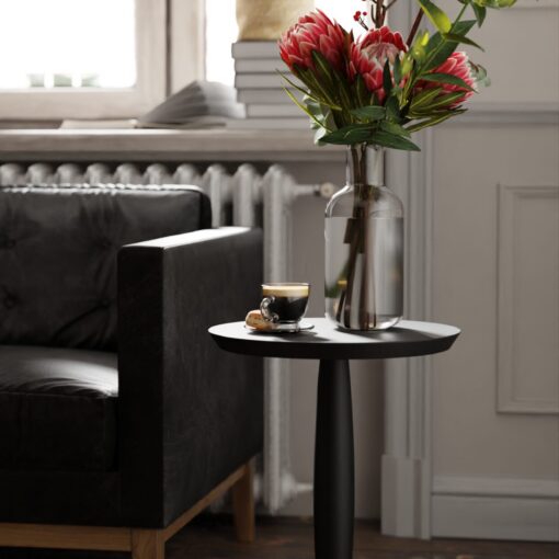 Sortmalt rundt sidebord